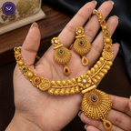 Shringarz Antique Matte Gold-Plated Nakshi Choker Set with Traditional Fan-Motif Pendant and Ruby-Emerald Accents