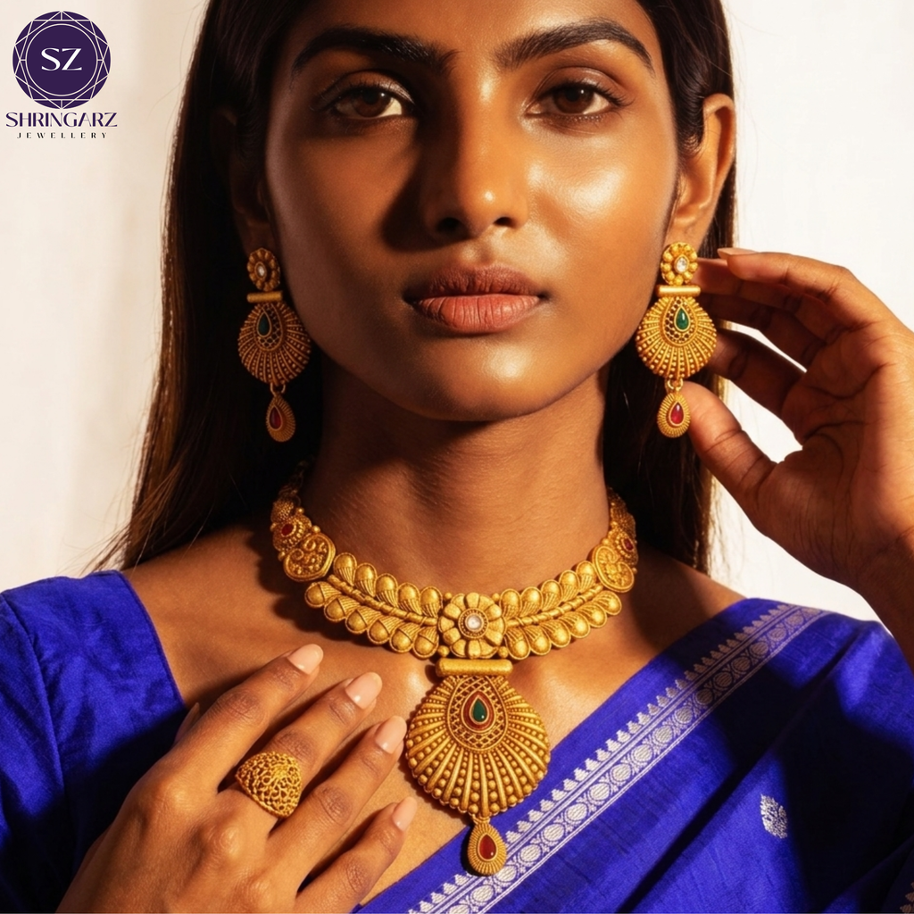 Shringarz Antique Matte Gold-Plated Nakshi Choker Set with Traditional Fan-Motif Pendant and Ruby-Emerald Accents