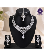 Shringarz Luxury Silver-Plated Cubic Zirconia Bridal Necklace Set – Intricate Lace Choker with Matching Drop Earrings and Maang Tikka Combo
