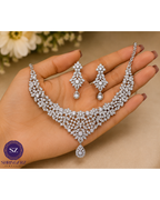 Shringarz Luxury Silver-Plated Cubic Zirconia Bridal Necklace Set – Intricate Lace Choker with Matching Drop Earrings and Maang Tikka Combo